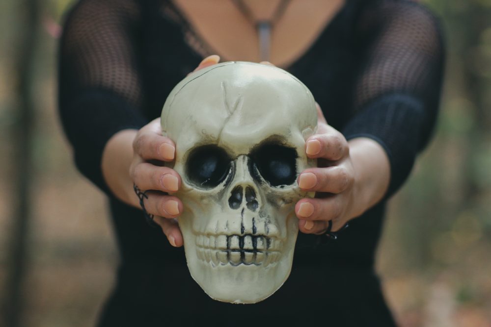 woman holding skull