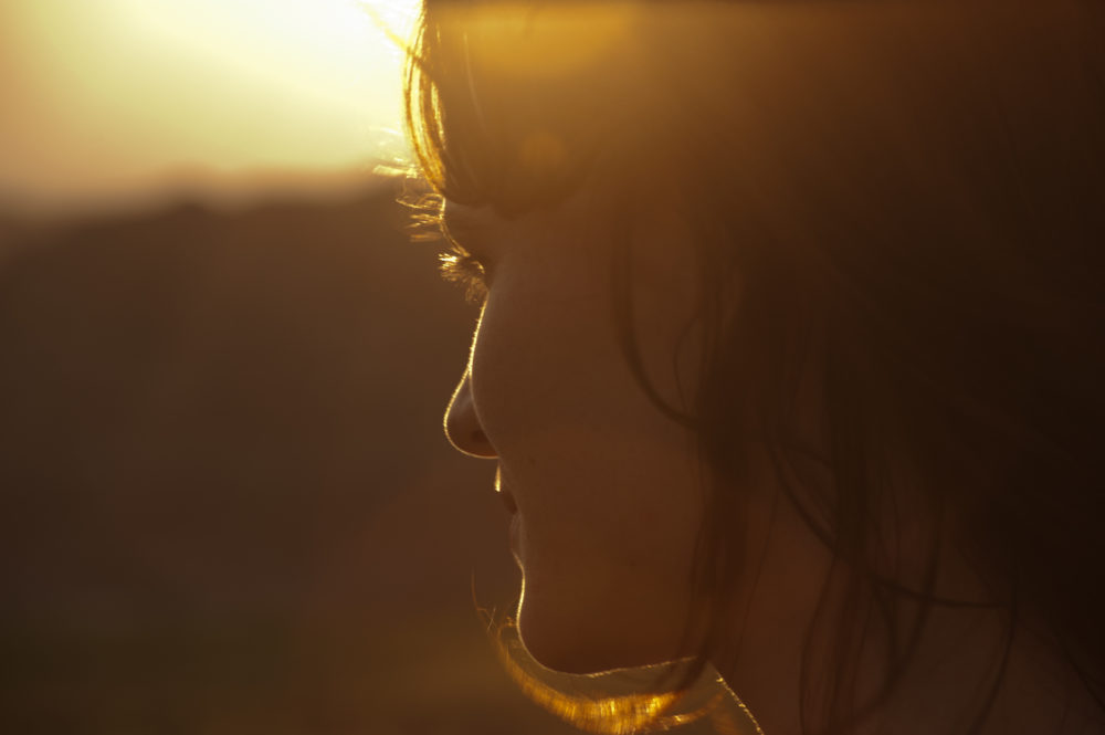 Woman in profile at sunset