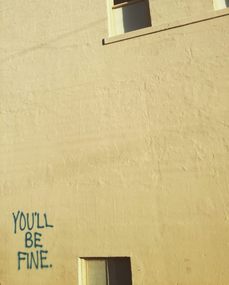 Picture of writing on wall that reads "you'll be fine"